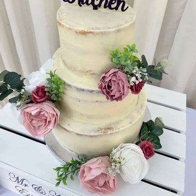 Semi-naked wedding cake, decorated with artificial flowers & foliage